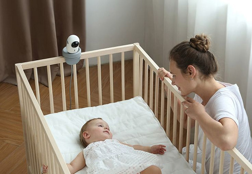 A baby sleeping in a crib 