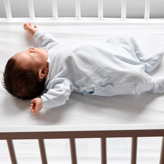 Baby sleeping in a crib